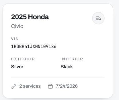 A vehicle card in RepairFyX showing its VIN, colours and service count.